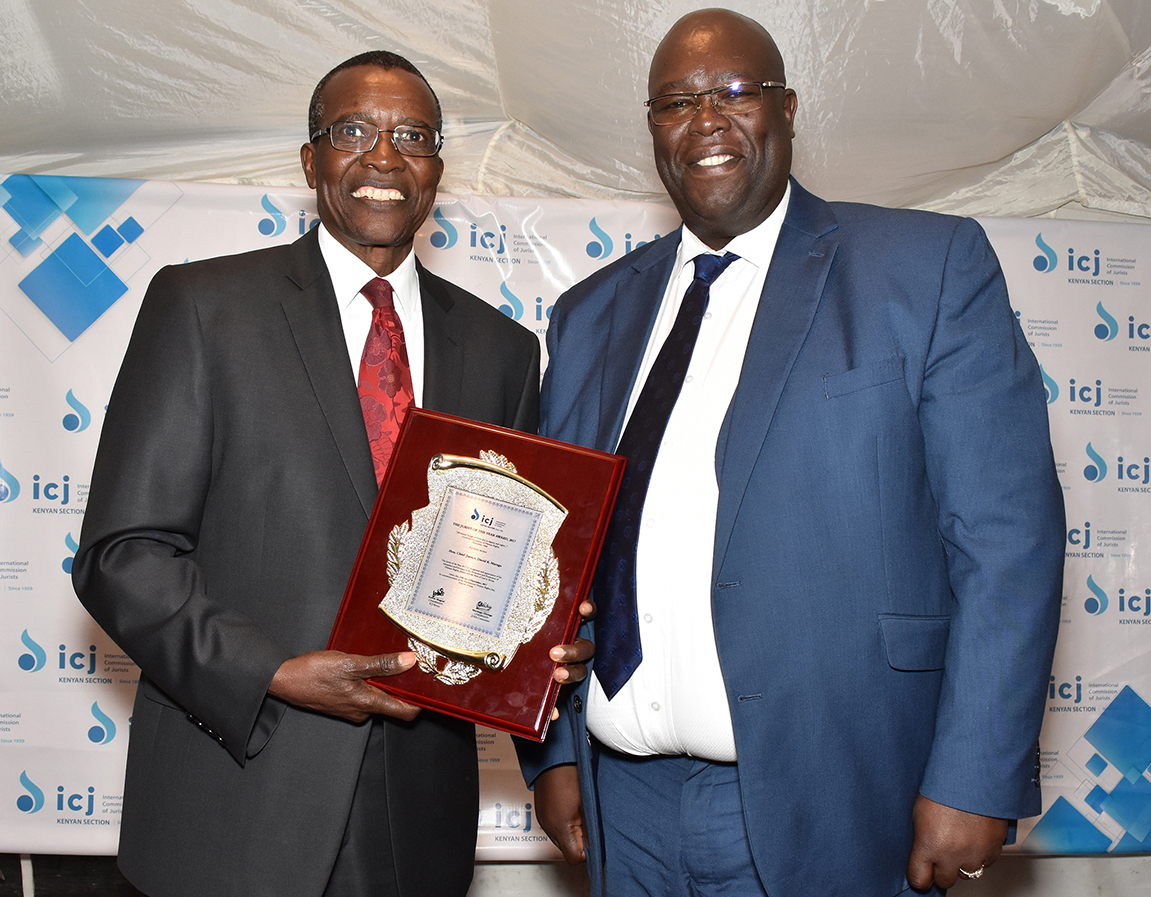 Chief Justice David Maraga L with ICJ Kenya Chairman Kelvin Mogeni poses with the Award