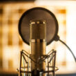 A condenser microphone in a recording studio.